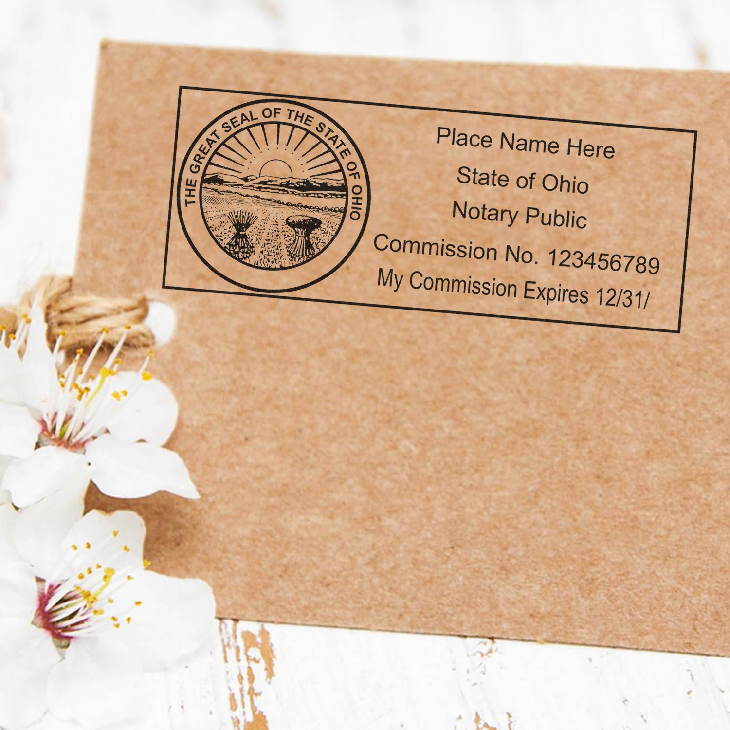 Essential Tools for Success: Ohio Notary Public Supply Guide Feature Image showing a notary stamp on a brown envelope with white flowers.