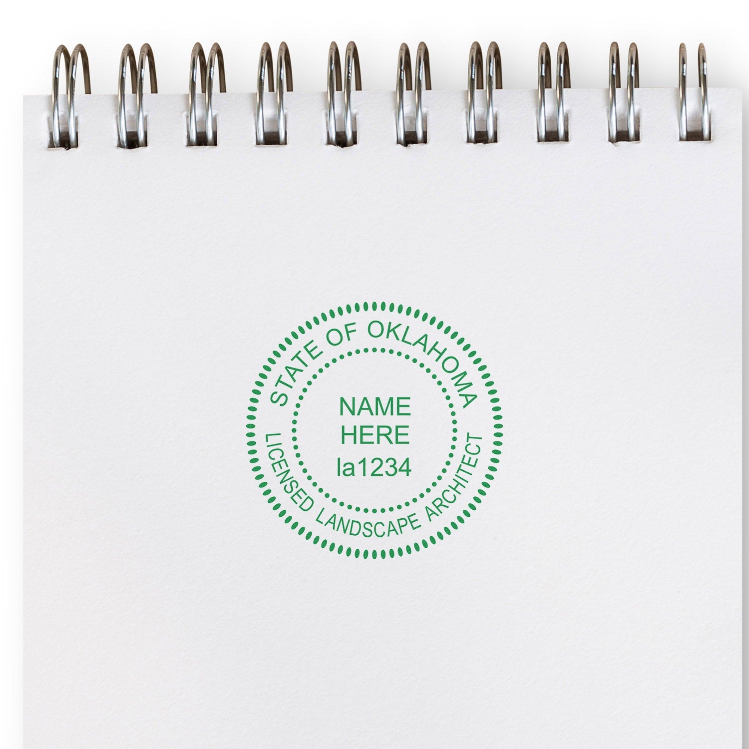 Oklahoma Landscape Architect Feature Image: A notebook with a green seal stamp reading 'State of Oklahoma Licensed Landscape Architect.'