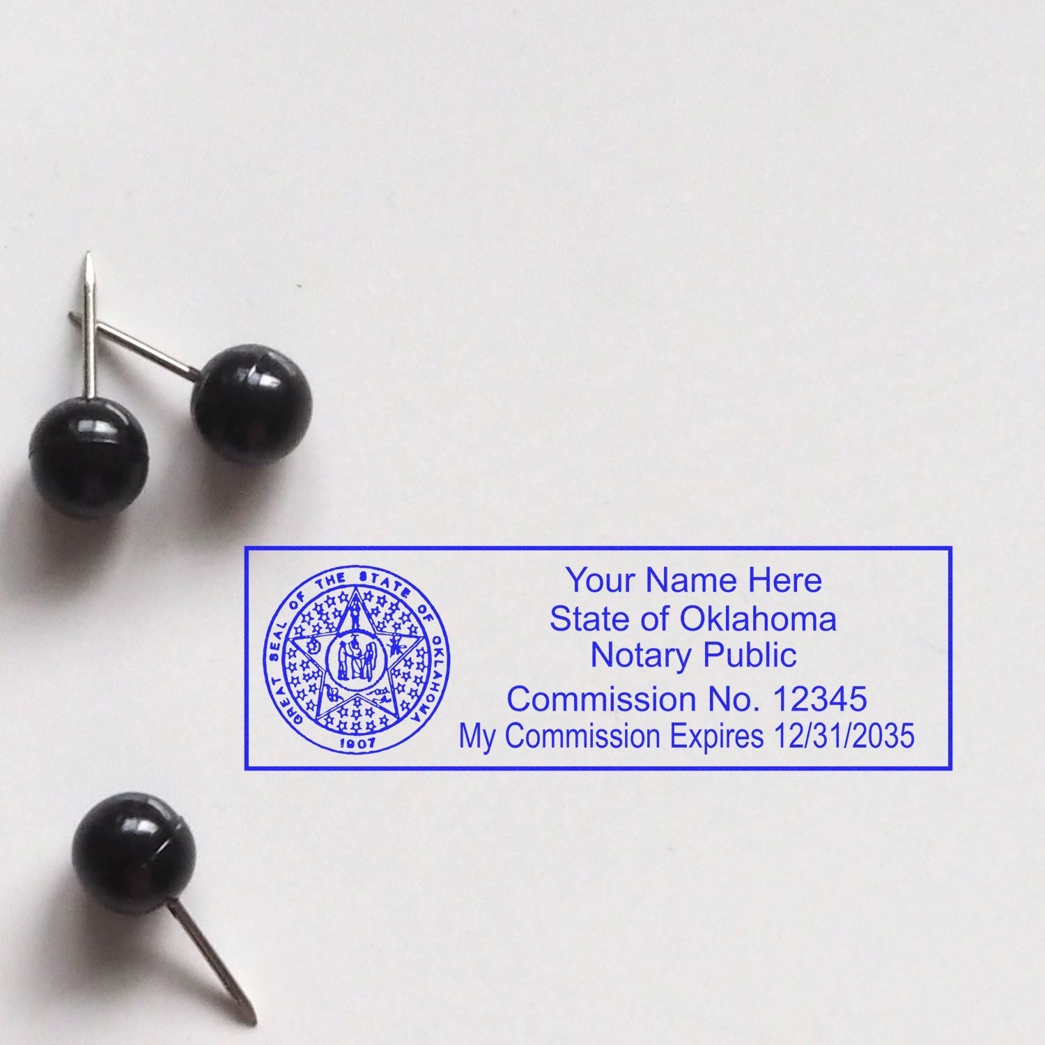 Master Your Notary Craft: Exploring Oklahoma Notary Supplies Feature Image. Oklahoma notary stamp with commission details and push pins.