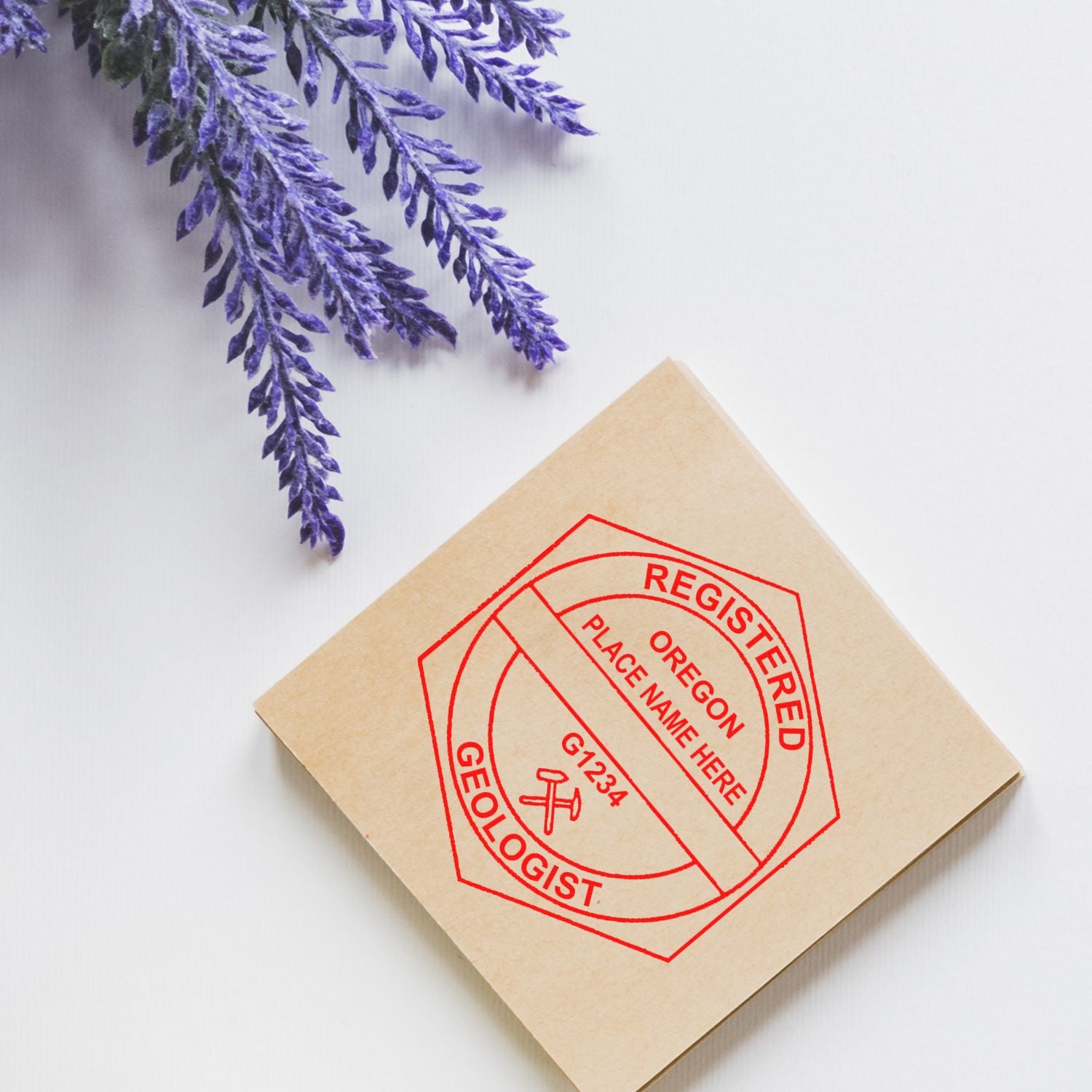 Renew Your Oregon Geologist Seal and Stamp Hassle-free Feature Image: A registered Oregon geologist stamp on a beige envelope with lavender sprigs.