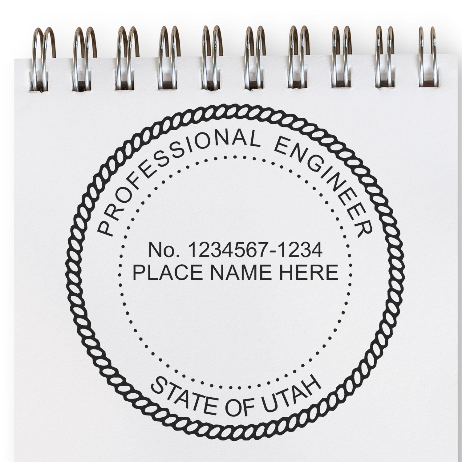 Image of a Utah Professional Engineer stamp on a notepad. Blog post: Power Up Your Engineering Career: Utah PE Stamp Requirements Feature Image.