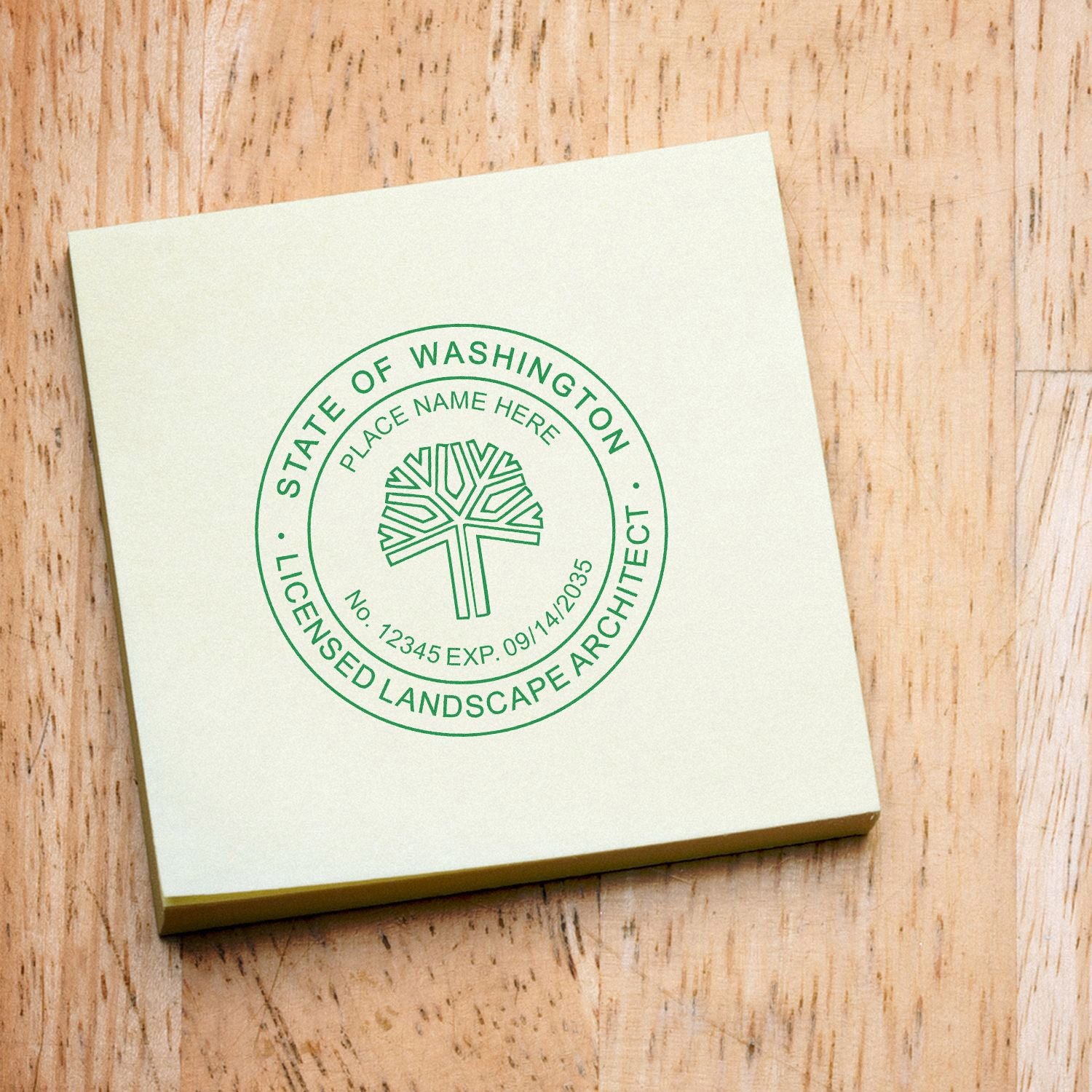 Washington Licensed Landscape Architect Seal on a notepad, featuring a tree emblem and license details. Blog post: Washington Licensed Landscape Architect Seal.