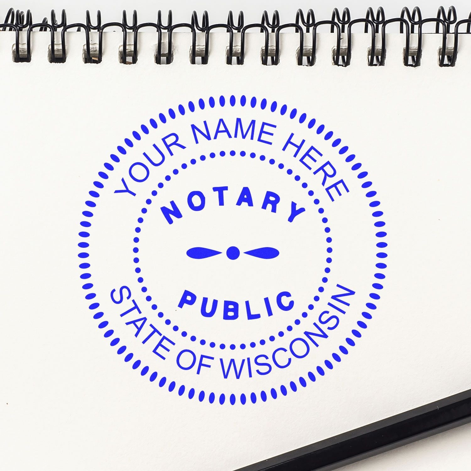 Image of a Wisconsin Notary Public stamp imprint on a notepad. Blog post: The Secret Weapon for Notaries: Wisconsin Notary Supplies Feature Image.
