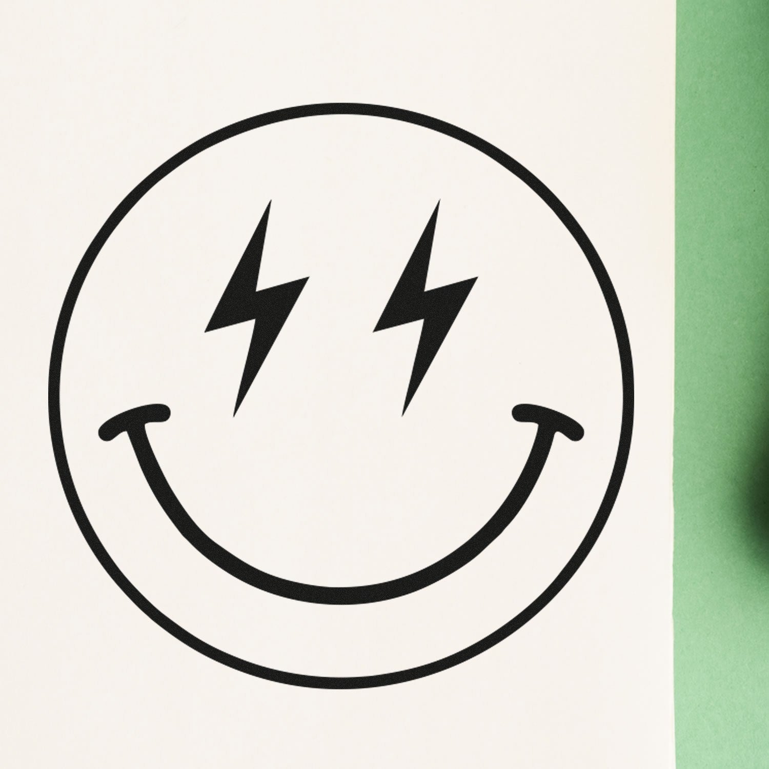 Wood Handle Electric Joy Emoji Rubber Stamp on paper, featuring a smiling face with lightning bolt eyes, showcasing its unique design and quality impression. Perfect for crafts and stationery.