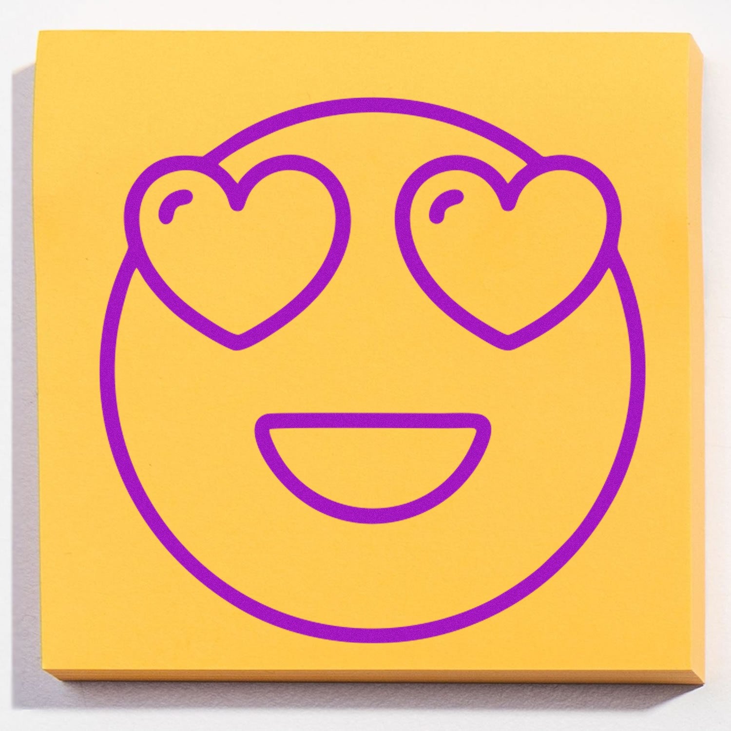 Wood Handle Love-Struck Larry Emoji Rubber Stamp featuring a smiling face with heart eyes, perfect for adding a playful touch to crafts and stationery.