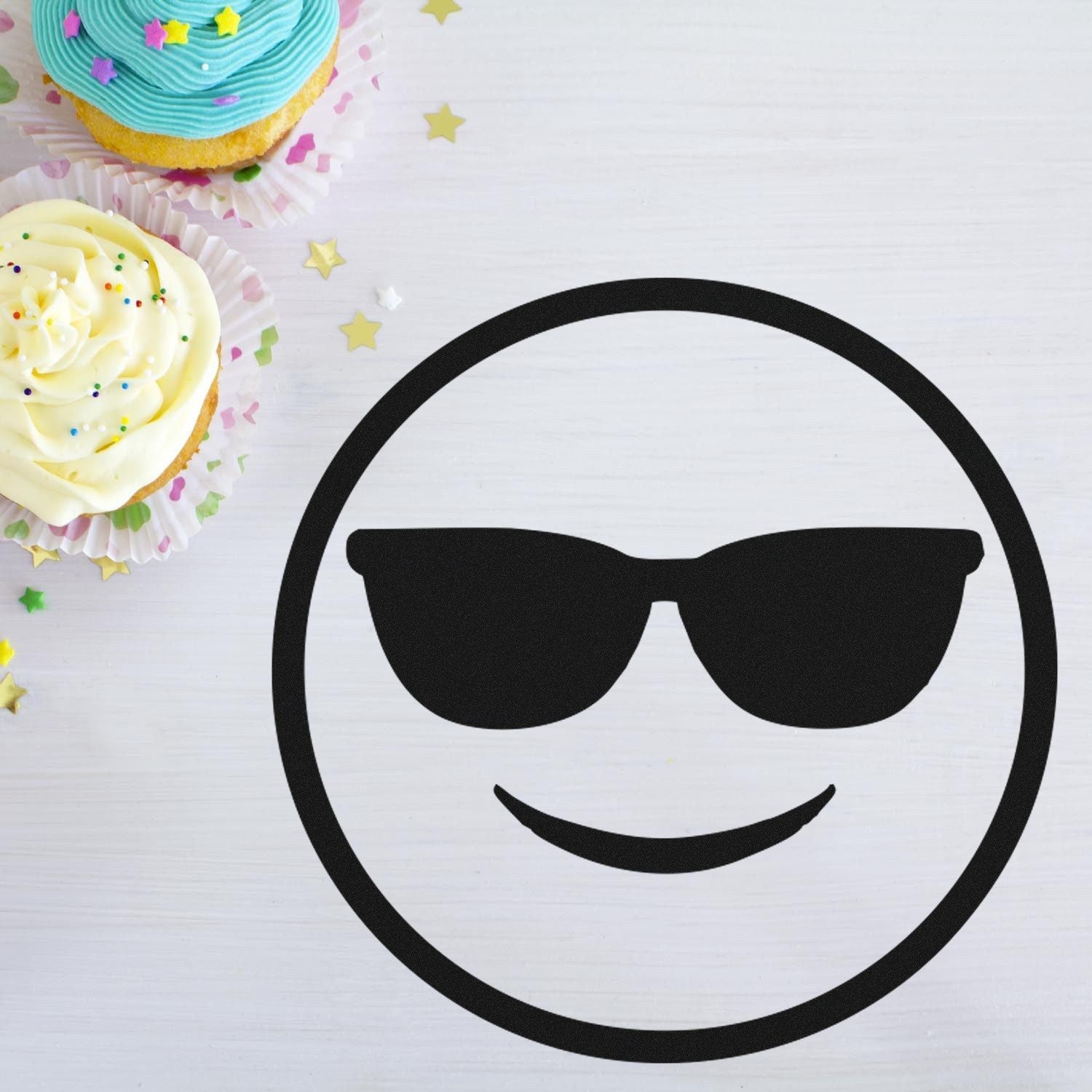 Self-Inking Cool Carl Emoji Stamp featuring a black sunglasses emoji design on a white background, perfect for adding fun to crafts and stationery.