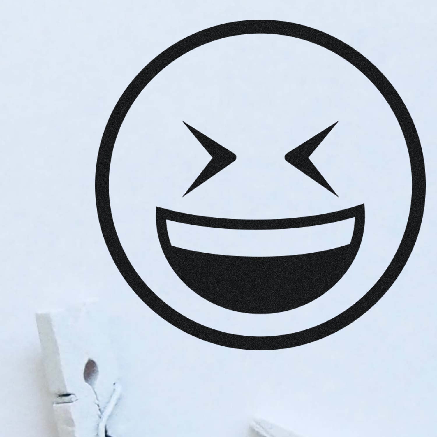 Wood Handle Excited Squint Emoji Rubber Stamp imprint on paper, showcasing a bold, expressive face with squinting eyes and a wide smile. Perfect for adding fun to crafts and stationery.