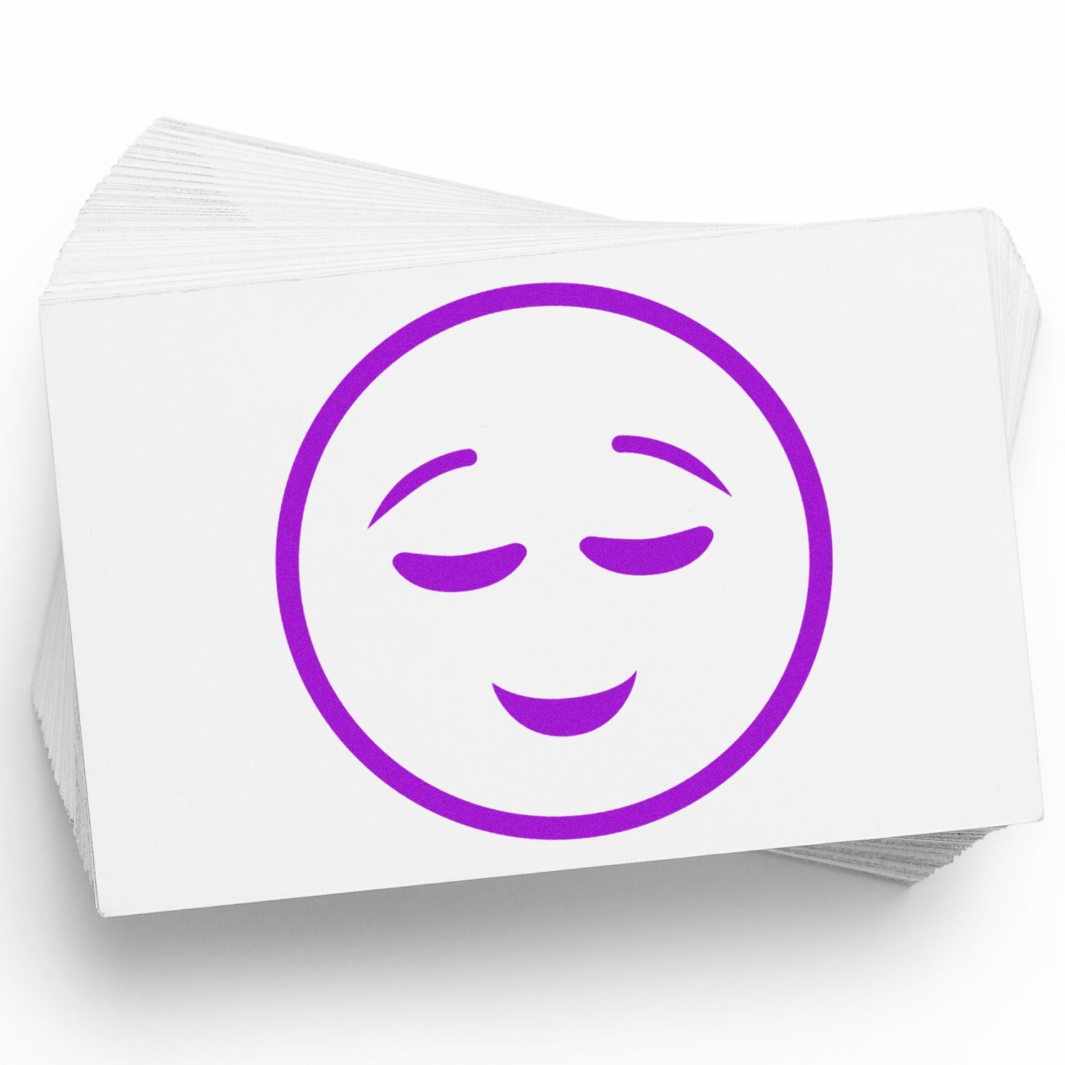 Wood Handle Contentment Facial Expressions Rubber Stamp featuring a serene purple face design on a stack of white cards. Perfect for adding a touch of calm to your projects.