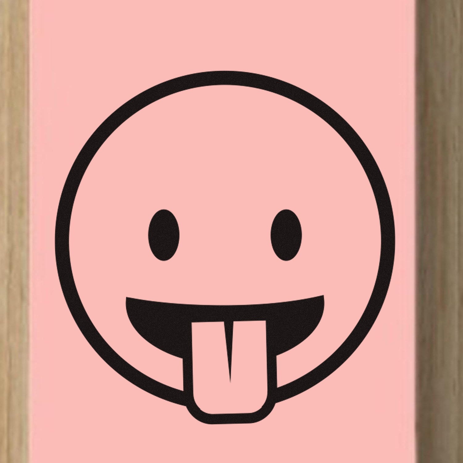 Wood Handle Goofy Grin Emoji Rubber Stamp featuring a playful face with a tongue out, perfect for adding fun to crafts and stationery. Durable wood handle and clear rubber design.