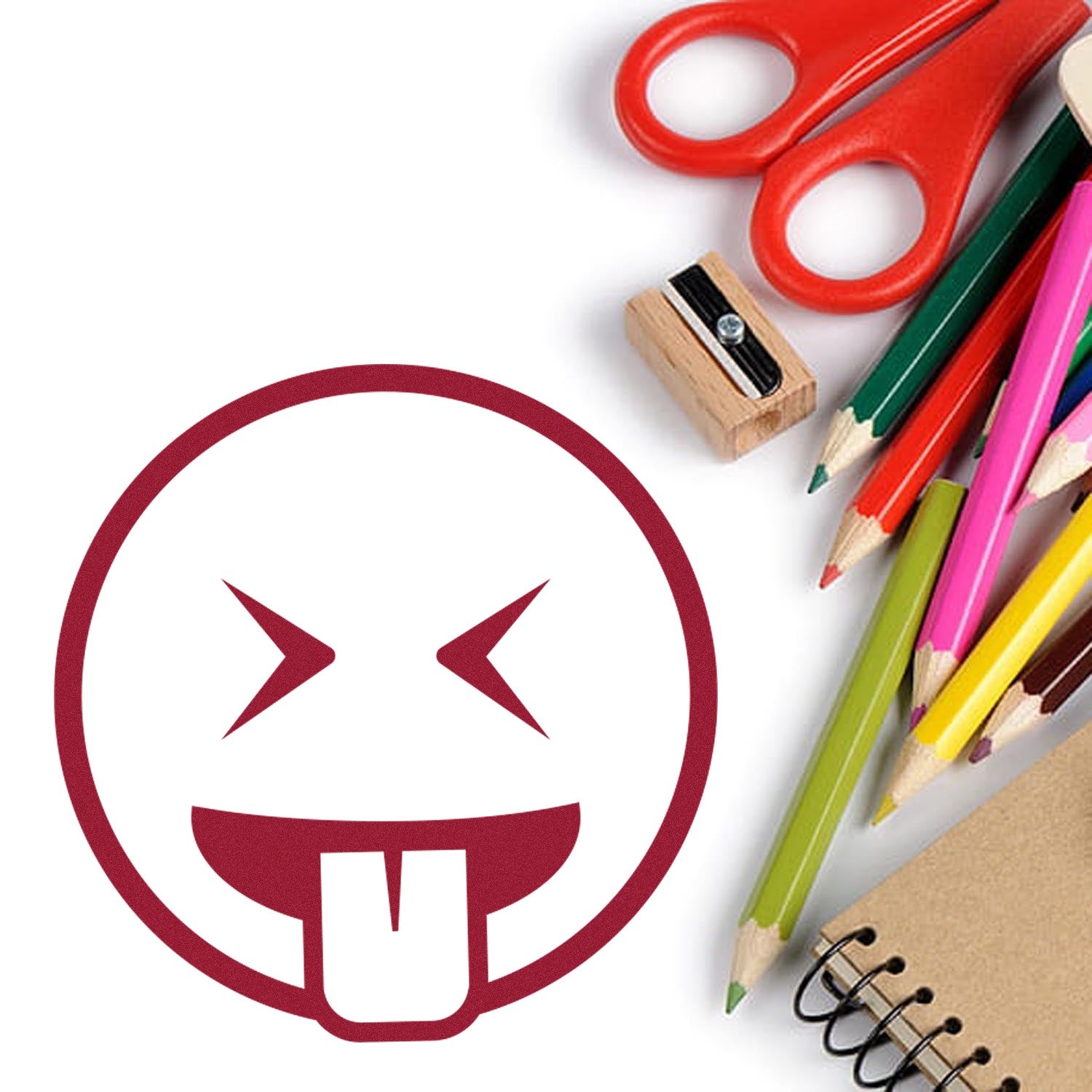 Self-Inking Crazy Face Emoji Stamp with a playful tongue-out design, shown alongside colorful pencils, scissors, and a notebook. Perfect for adding fun to crafts and stationery.