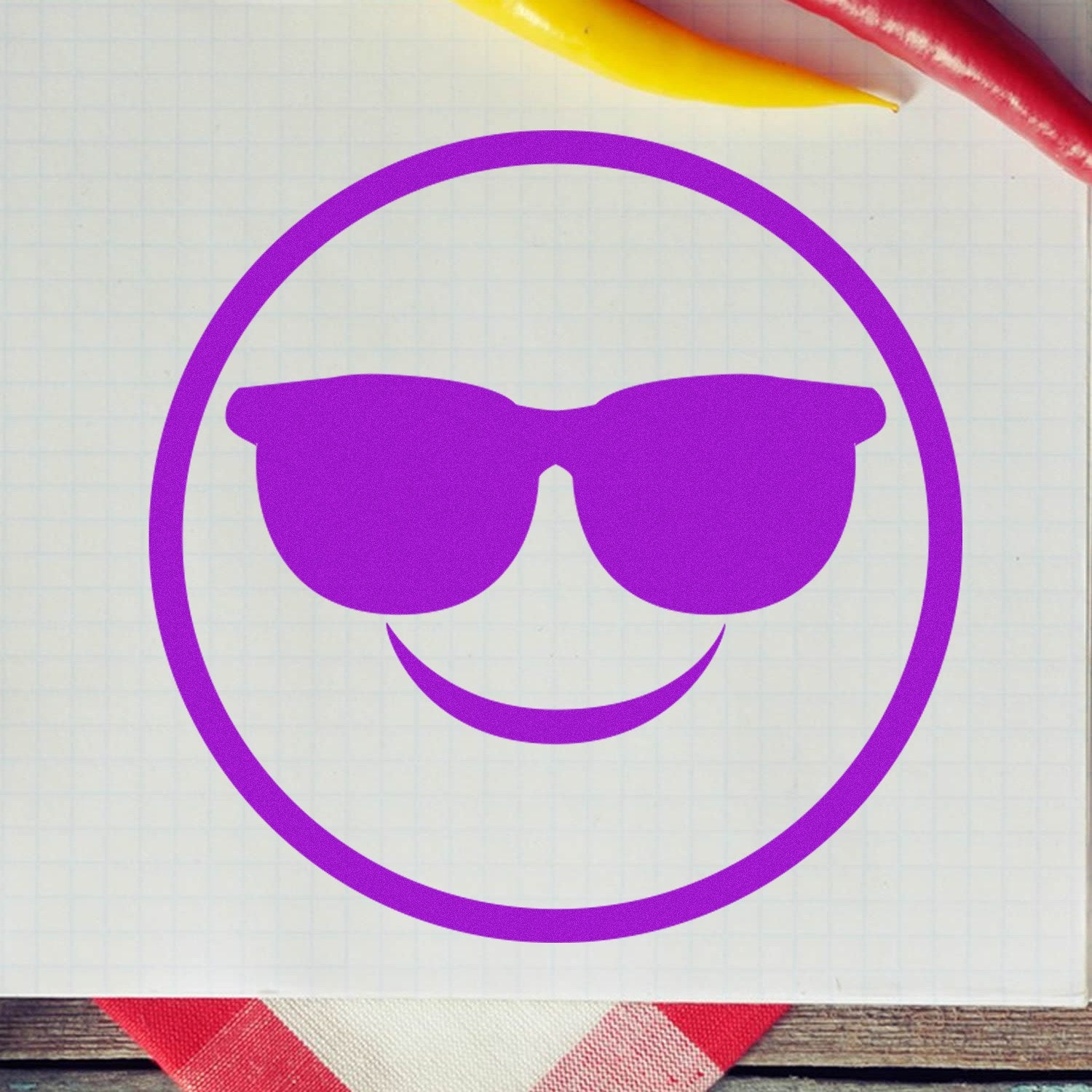 Wood Handle Cool Shades Pictogram Rubber Stamp featuring a purple smiley face with sunglasses, perfect for adding a fun touch to crafts and stationery. Ideal for creative projects.