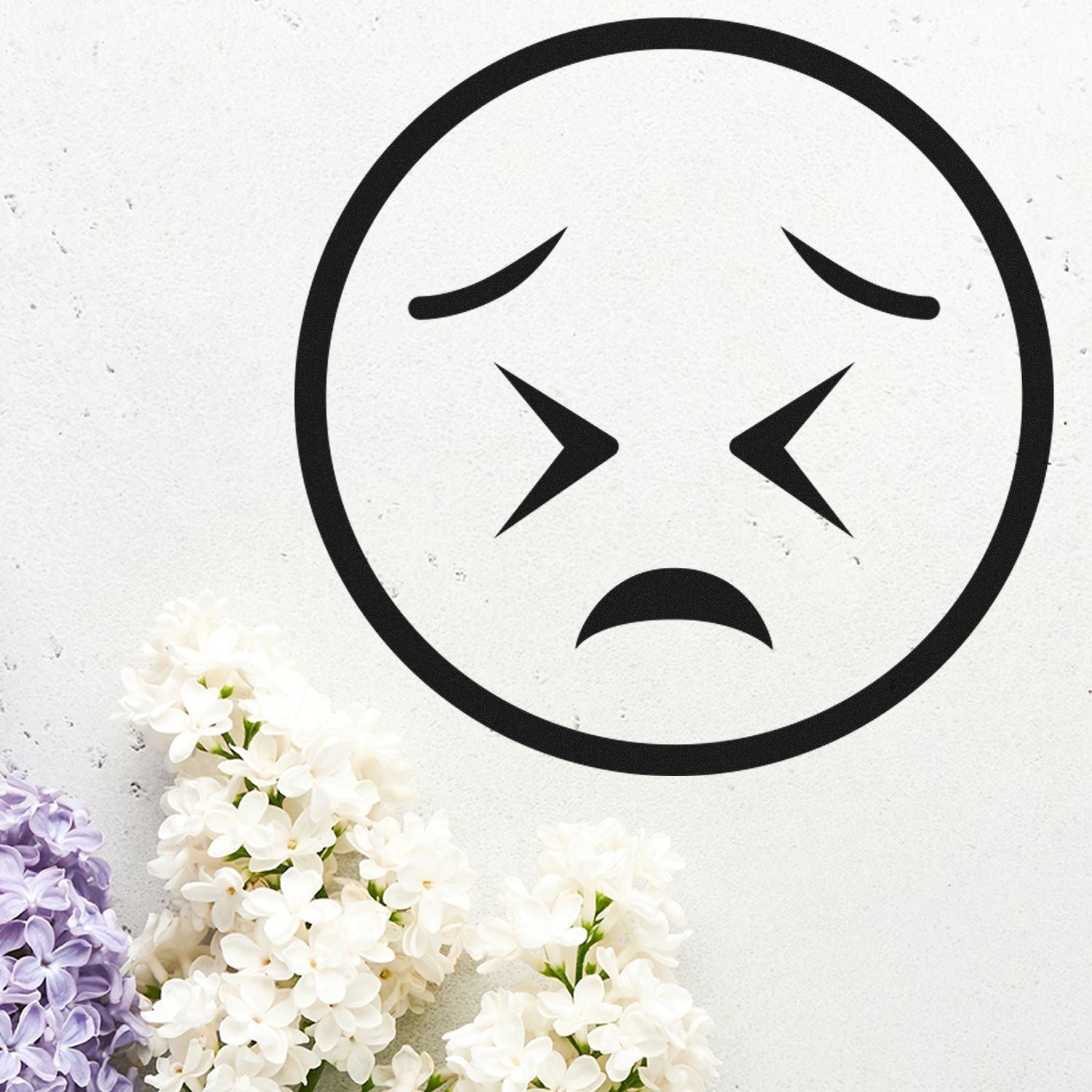 Self-Inking Starry Sadness Emoji Stamp on white background with purple and white flowers. Perfect for adding a touch of emotion to your stationery or crafts.