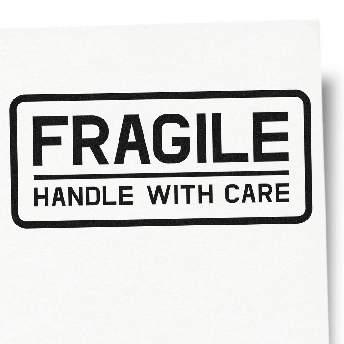 PSI Pre-Inked Fragile Handle With Care Shipping Stamp on white paper, showcasing bold black text in a rectangular border, ideal for marking packages.