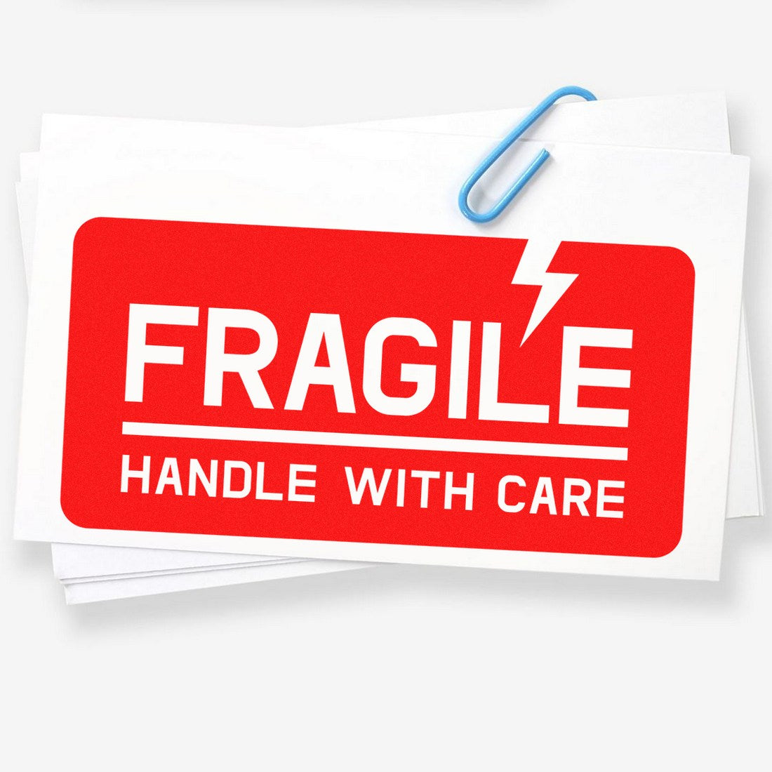 Maxlight Premium Lightning Fragile Stamp in use, featuring a bold red design with a lightning bolt and FRAGILE HANDLE WITH CARE text, ideal for marking delicate packages.