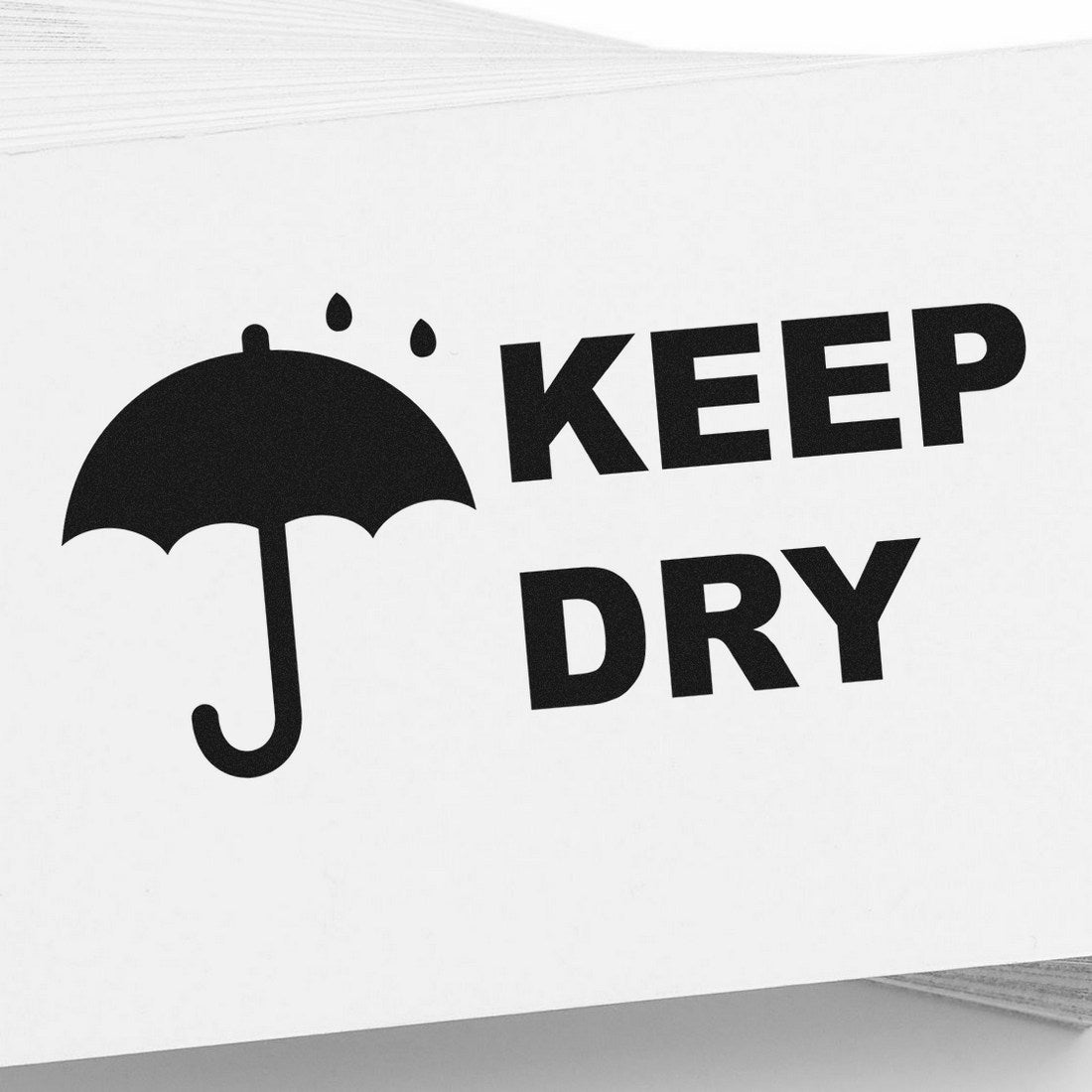 Slim Pre-Inked Keep Dry with Umbrella Stamp featuring a black umbrella icon and 'Keep Dry' text on a white background, ideal for marking packages and documents.