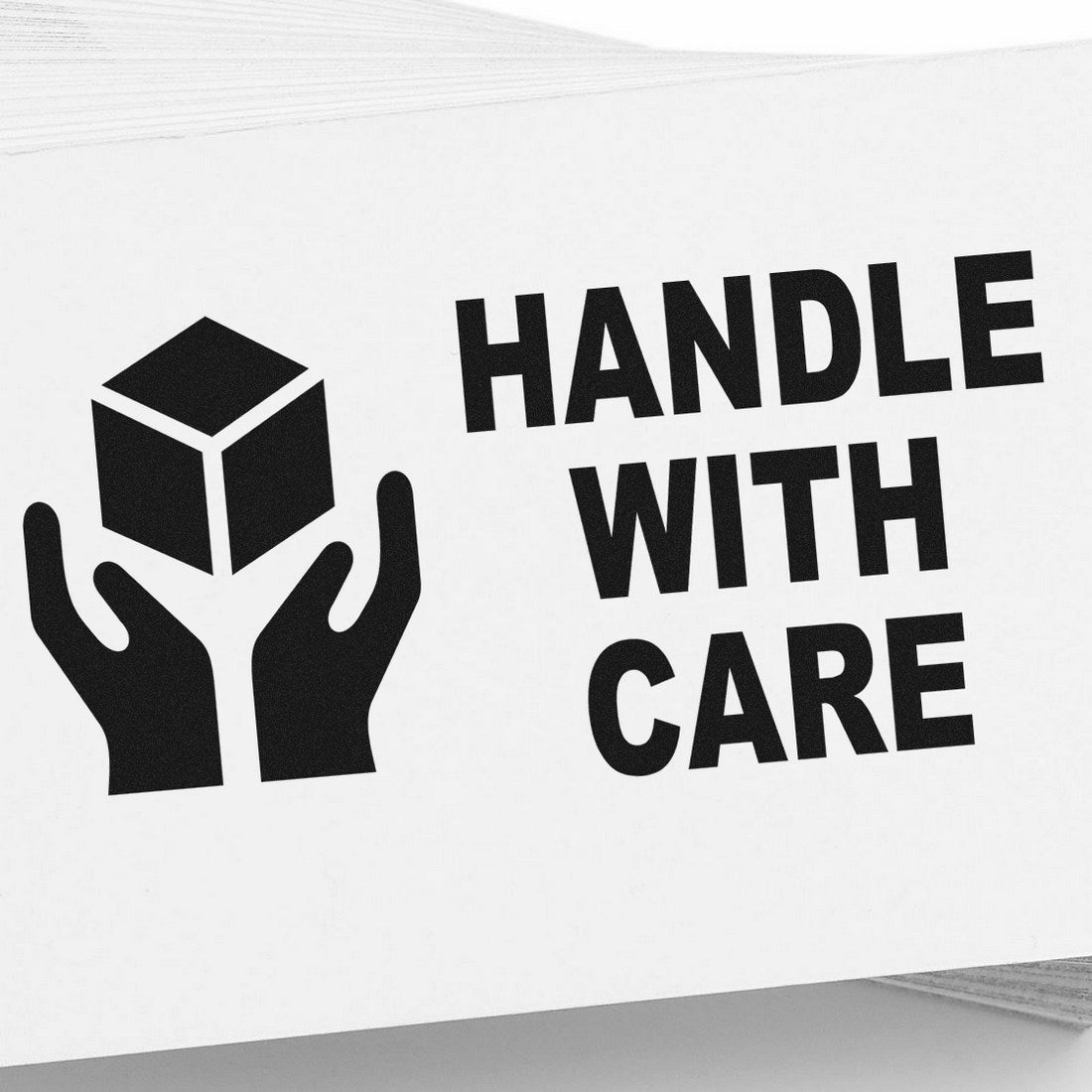 Self-Inking Handle With Care Stamp featuring bold black text and icon of hands holding a box, ideal for marking packages.