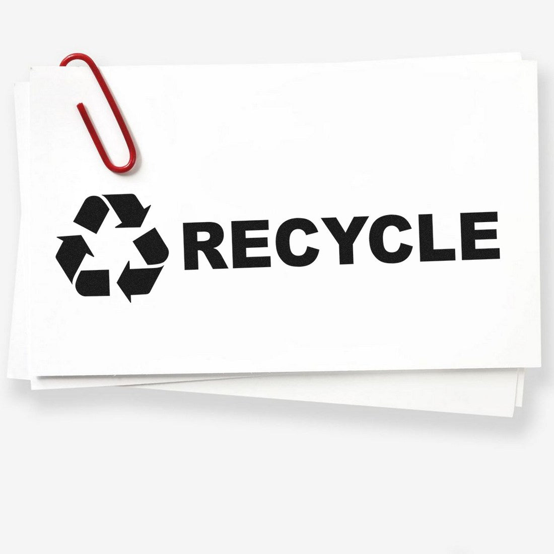 Maxlight Premium Recycle Symbol Stamp on white paper with a red paperclip, featuring a bold black recycle symbol and the word RECYCLE in capital letters. Ideal for eco-friendly labeling.