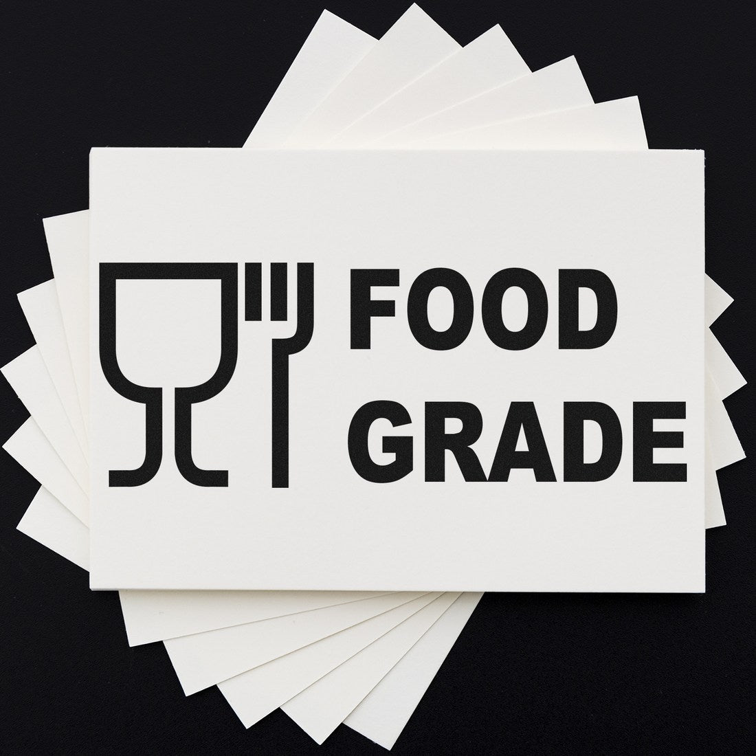 Wood Handle Certified Food Grade Rubber Stamp on black background, featuring a food-safe symbol and 'FOOD GRADE' text, ideal for marking food packaging and products.