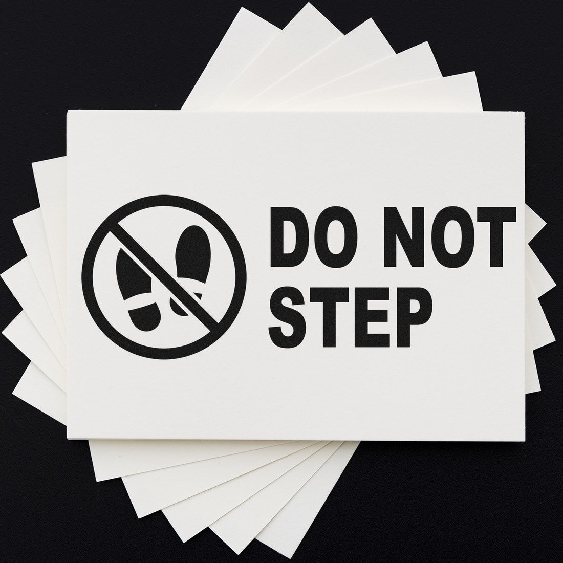 Self-Inking Caution Do Not Step Stamp with bold black text and a no-step symbol on a white background, ideal for safety warnings and preventing accidents.