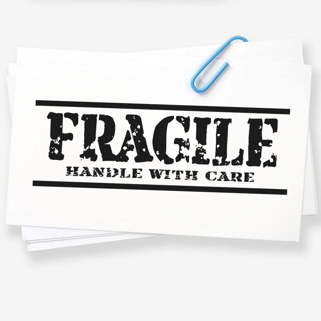 Slim Pre-Inked Rustic Fragile Handle With Care Stamp on white paper, showcasing bold, distressed lettering. Ideal for packaging and shipping needs.