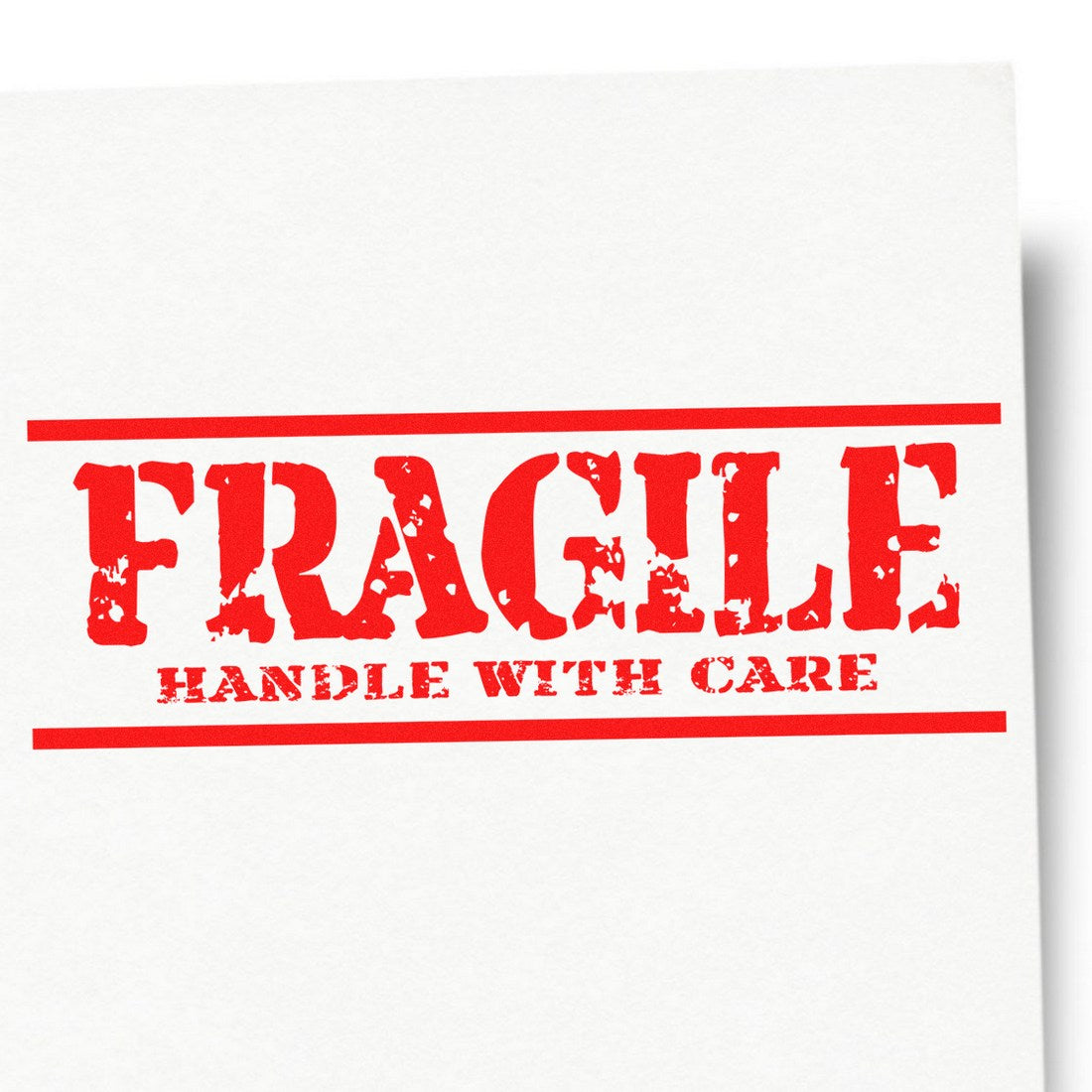 Self-Inking Rustic Fragile Handle With Care Stamp in red ink on white paper, showcasing bold, distressed lettering for marking packages. Ideal for shipping and handling needs.