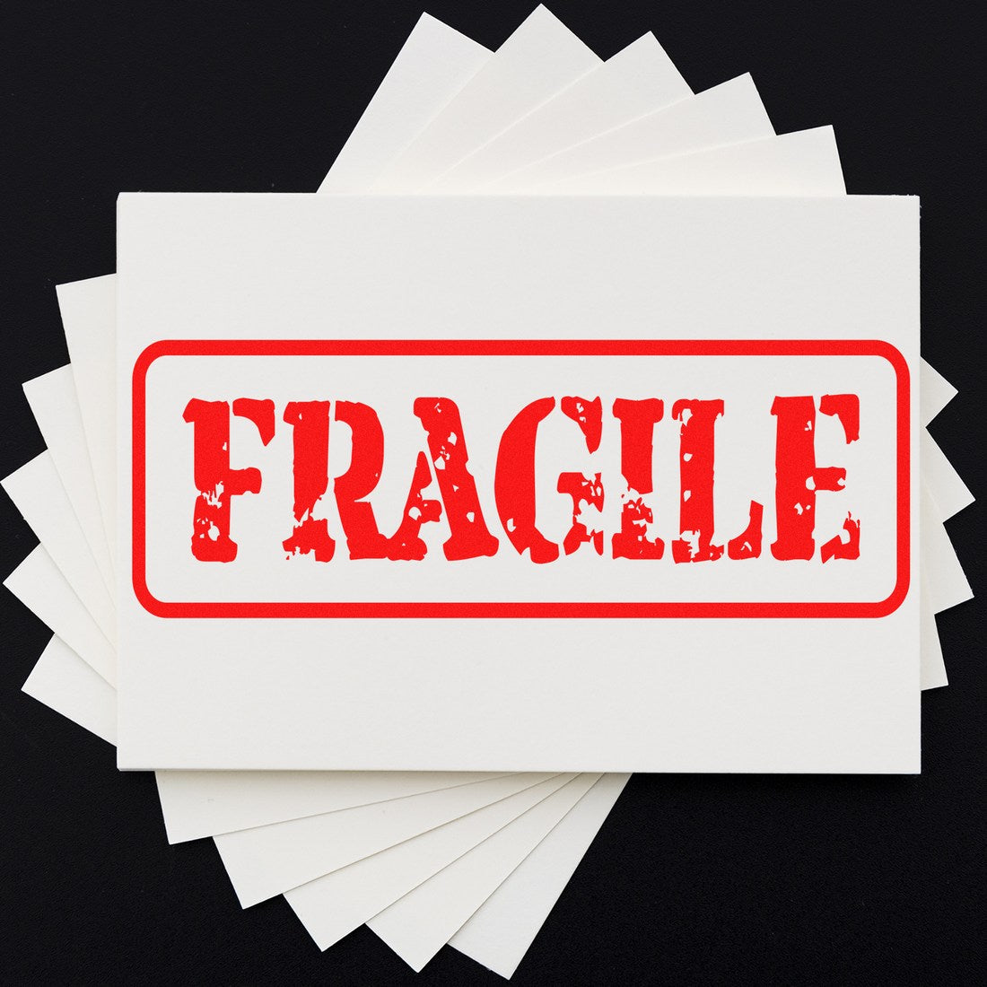 PSI Pre-Inked Fragile Packing Stamp with bold red 'FRAGILE' text on white background, ideal for marking packages. Compact and efficient design for easy use.