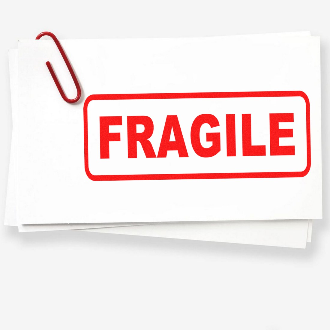 Image of a Wood Handle Fragile Rubber Stamp with a bold red FRAGILE imprint on white paper, ideal for marking packages.