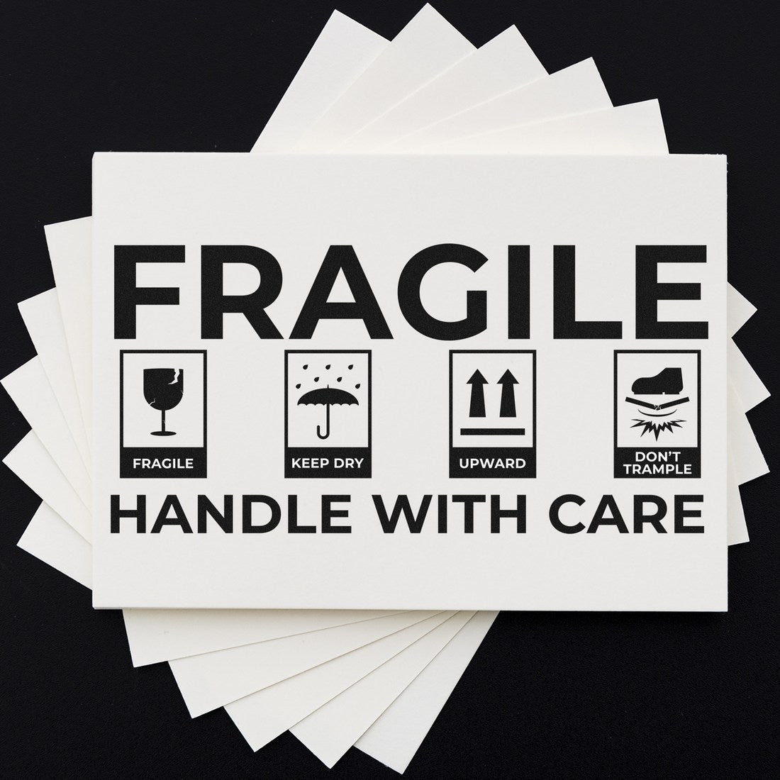 PSI Pre-Inked Fragile Shipping Stamp on black background, featuring icons for fragile, keep dry, upward, and don't trample, with Handle With Care text. Ideal for shipping labels.