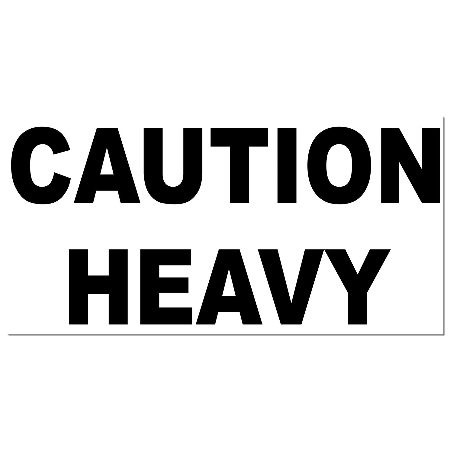 PSI Pre-Inked Heavy Caution Stamp with bold black 'CAUTION HEAVY' text on a white background, ideal for marking packages and materials.