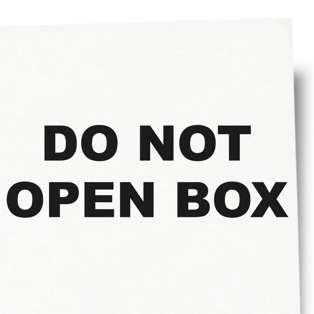 Self-Inking Do Not Open Box Stamp with bold black text on a white background, ideal for packaging and shipping needs.