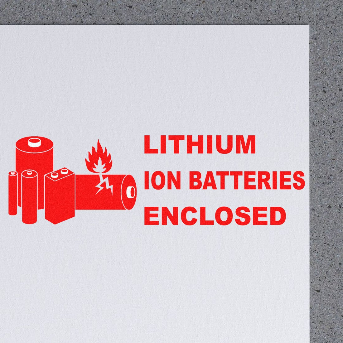 Slim Pre-Inked Lithium Ion Battery Warning Stamp with red battery icons and 'Lithium Ion Batteries Enclosed' text on a white background.