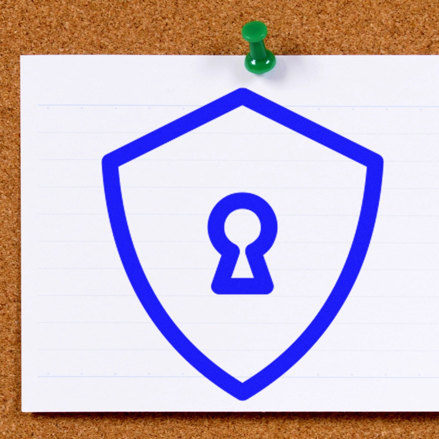 Image of a Self-Inking Secure Return Visit Stamp with a blue shield and keyhole design on a white card pinned to a corkboard. Ideal for secure document marking and easy return visit tracking.