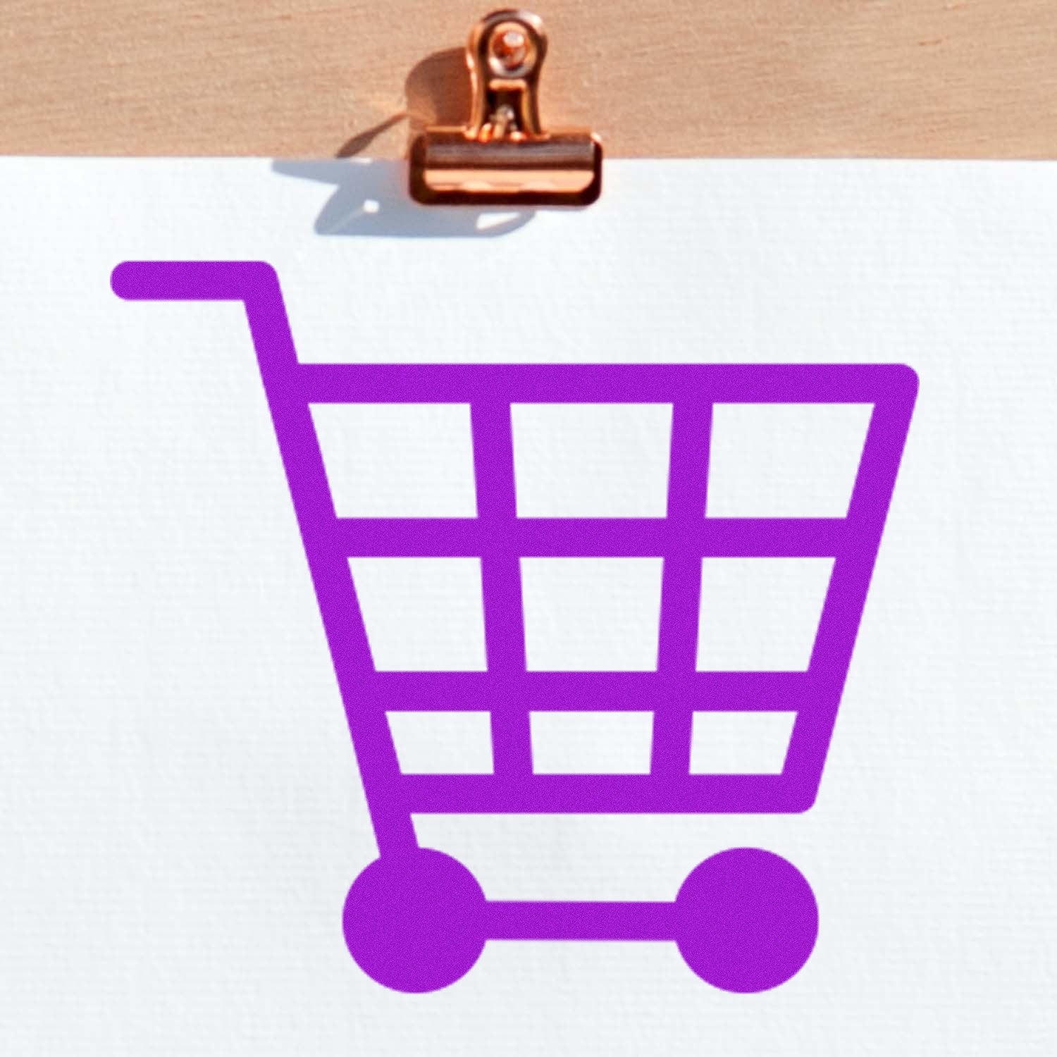 Self-Inking Shopper's Delight Discount Stamp with a purple shopping cart design on white paper, featuring a wooden clip at the top. Ideal for retail and promotional use.