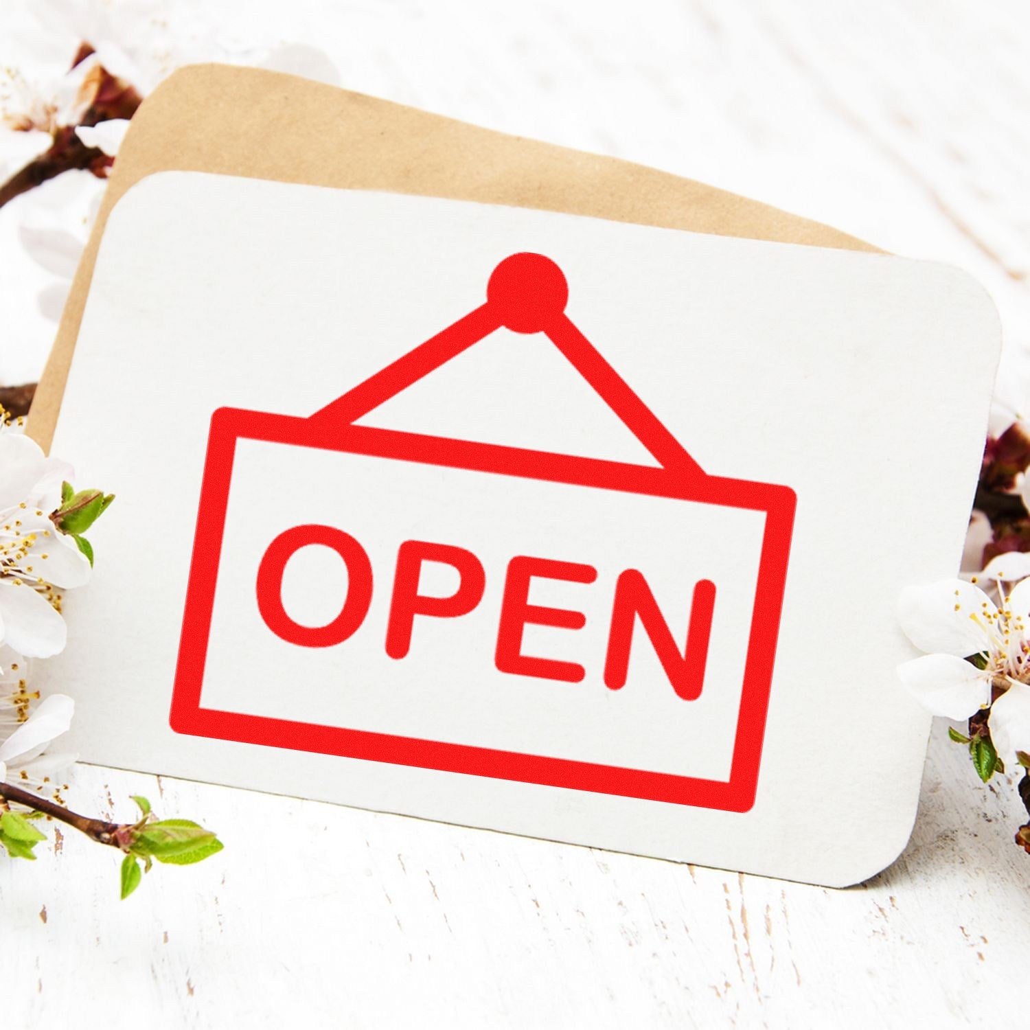 Image of a Self-Inking Open Sign Loyalty Stamp with a red OPEN sign design, placed on a white card with floral accents, ideal for businesses.