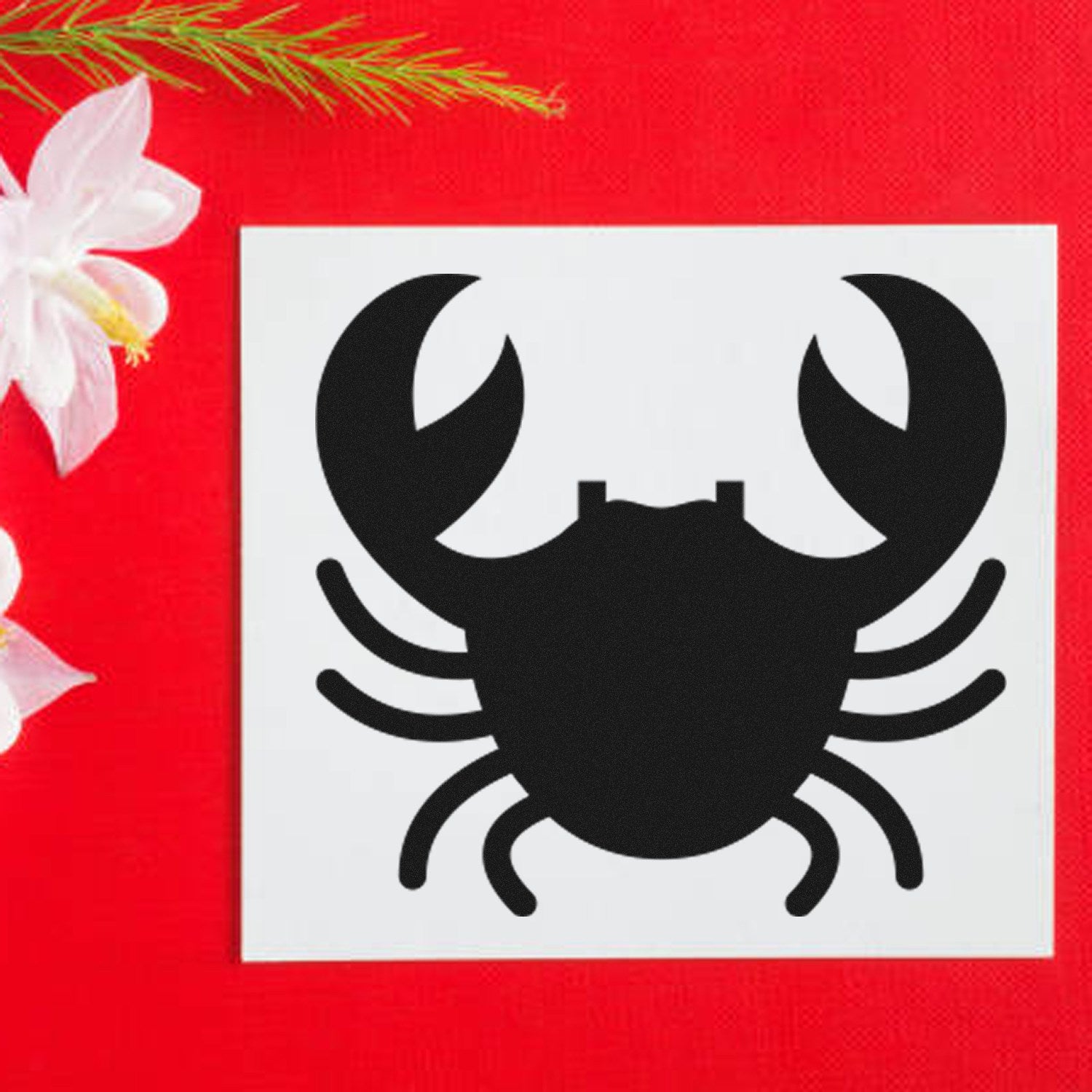 Wood Handle Crabby Rewards Rubber Stamp featuring a black crab design on a white background, set against a red surface with white flowers. Perfect for crafting and decoration.