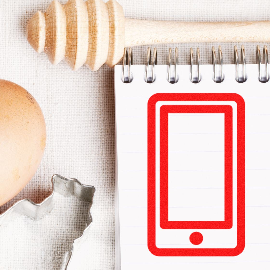 Self-Inking Phoned In Collection for Rewards Stamp featuring a red smartphone icon on a white notepad, surrounded by a honey dipper, egg, and cookie cutter on a textured surface.