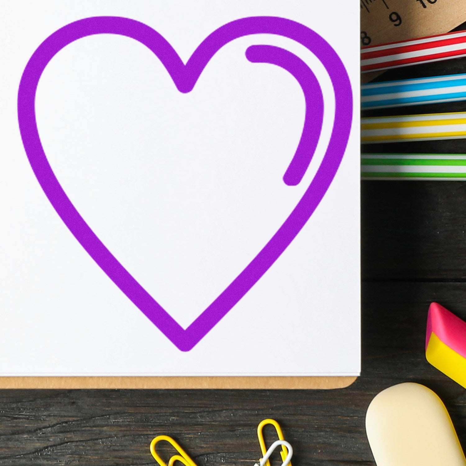 Self-Inking Heartfelt Loyalty Stamp with a vibrant purple heart design on white paper, perfect for adding a personal touch to documents. Ideal for teachers and businesses.