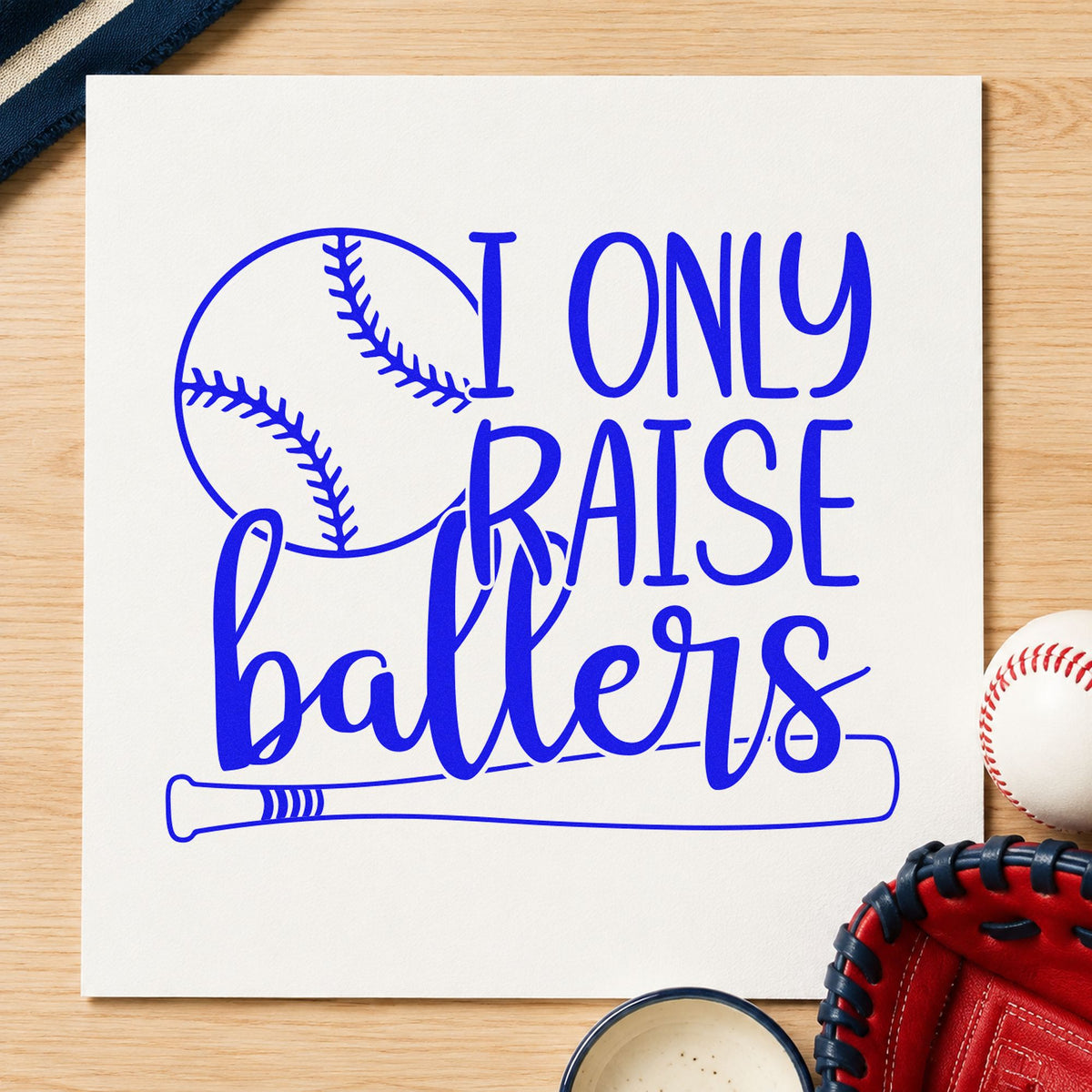 I Only Raise Ballers craft stamp imprinted in blue ink on paper, a design suited to banquet place cards.