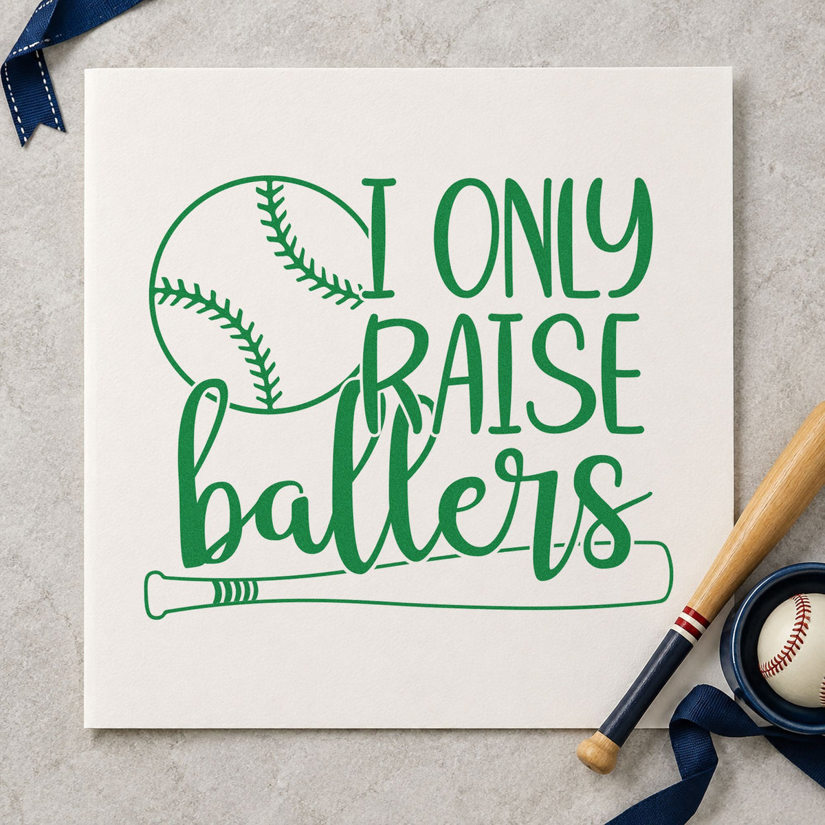 I Only Raise Ballers craft stamp imprint in green ink on a handmade project, one idea being nursery wall art.