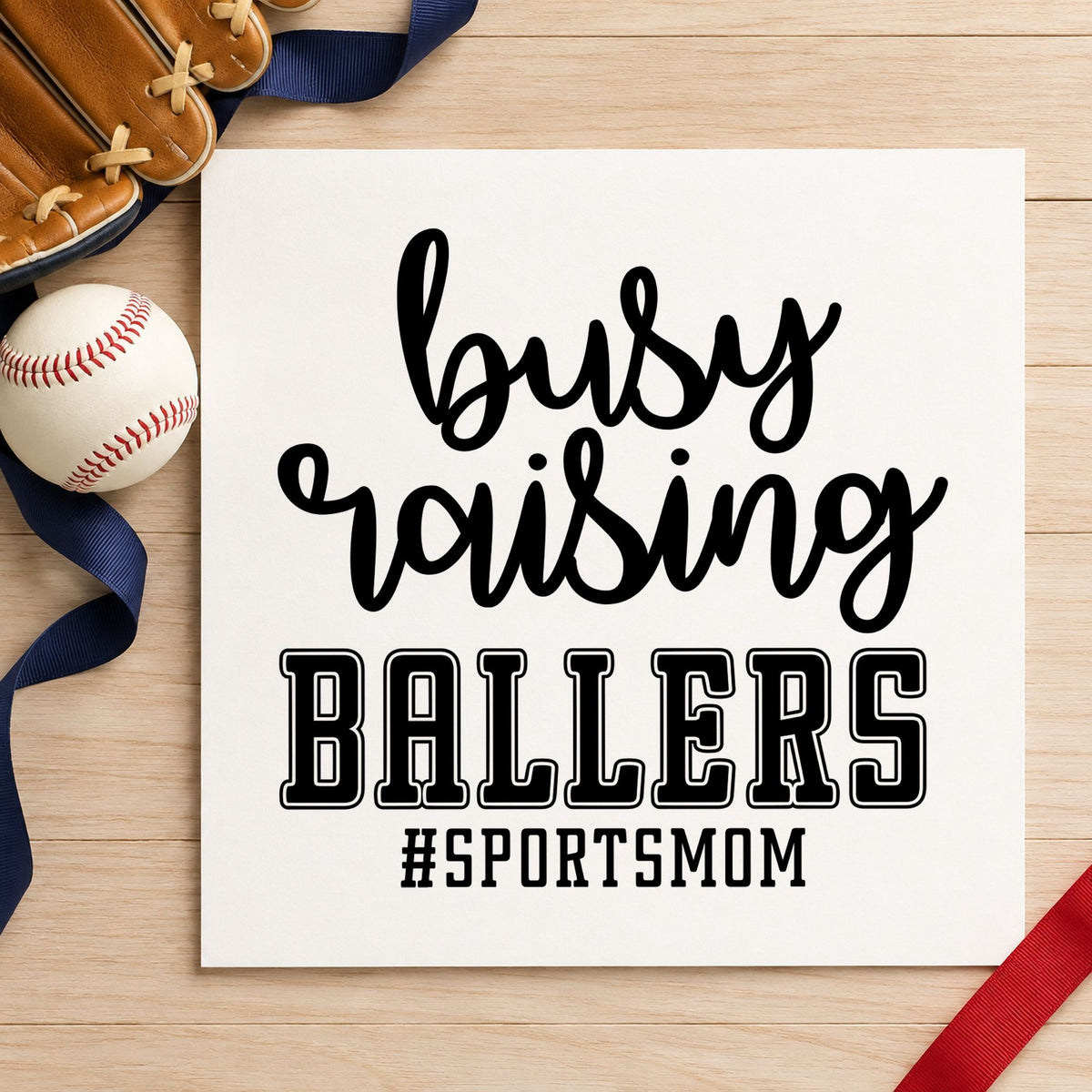 Busy Raising Ballers craft stamp in black ink on cardstock, an easy option for travel team scrapbooks.