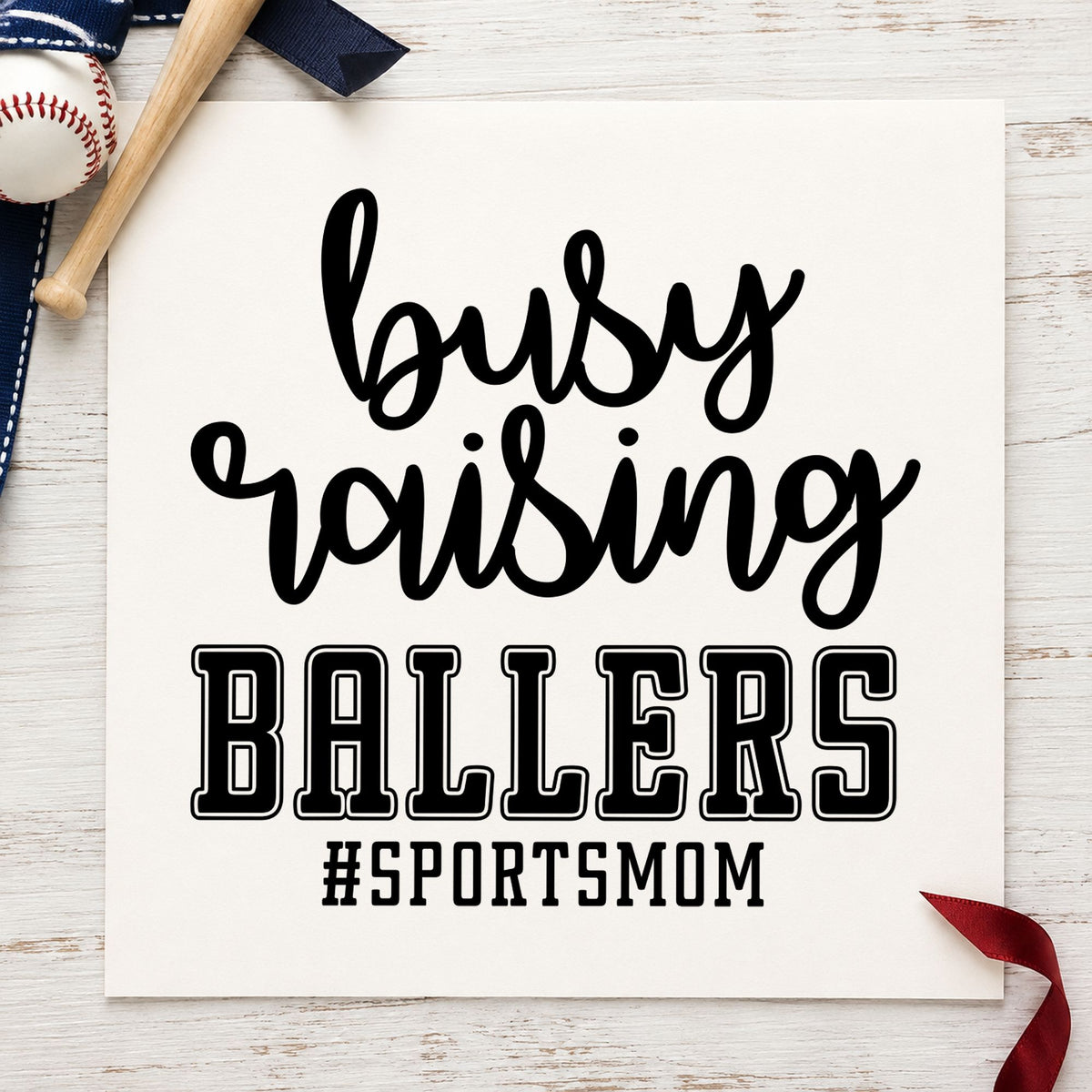 Busy Raising Ballers craft stamp imprint in black ink on a handmade project, one idea being snack duty bag toppers.