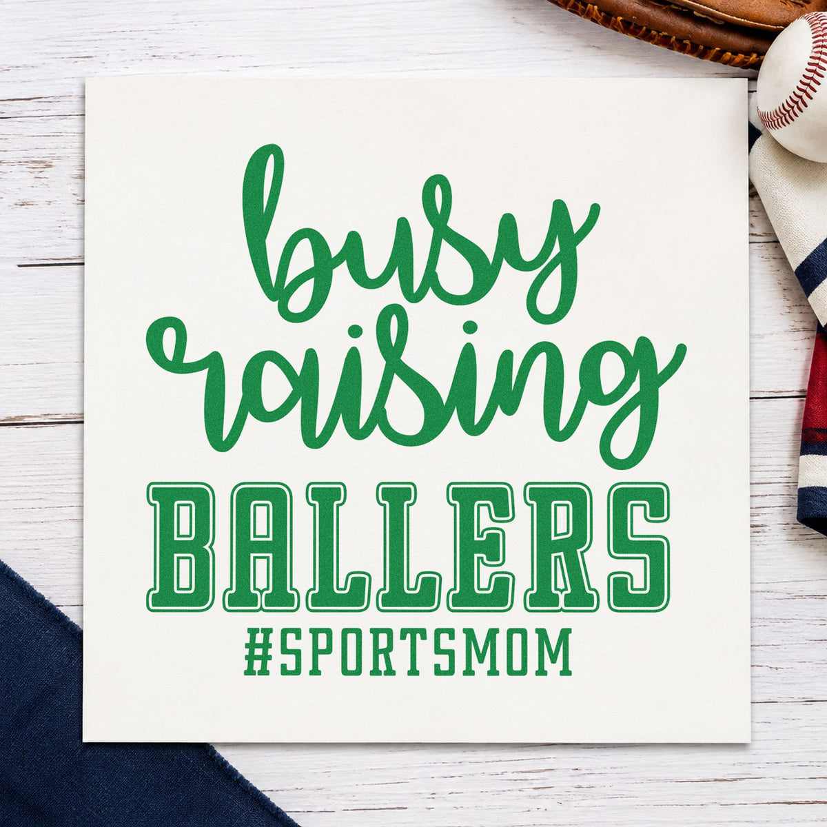 Busy Raising Ballers craft stamp imprint in green ink on a handmade project, one idea being booster club sign-ups.