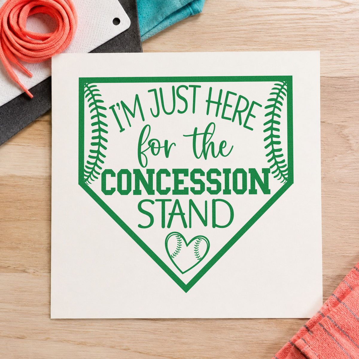 Concession Stand Fan craft stamp imprint in green ink on a handmade project, one idea being sibling fan tees.
