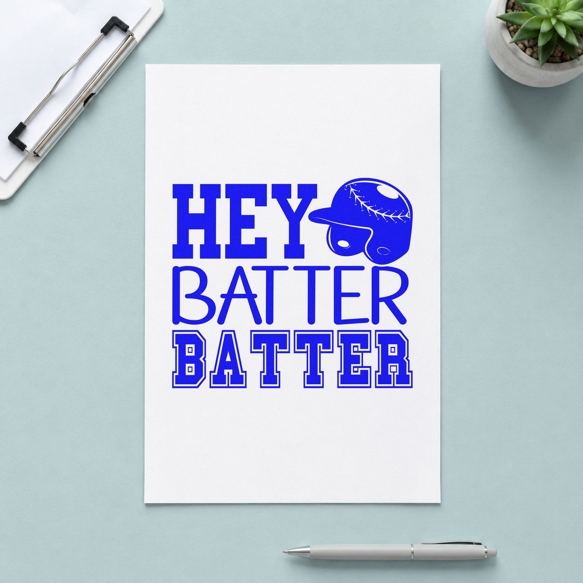 Hey Batter Batter craft stamp imprinted in blue ink on paper, a design suited to nursery wall art.
