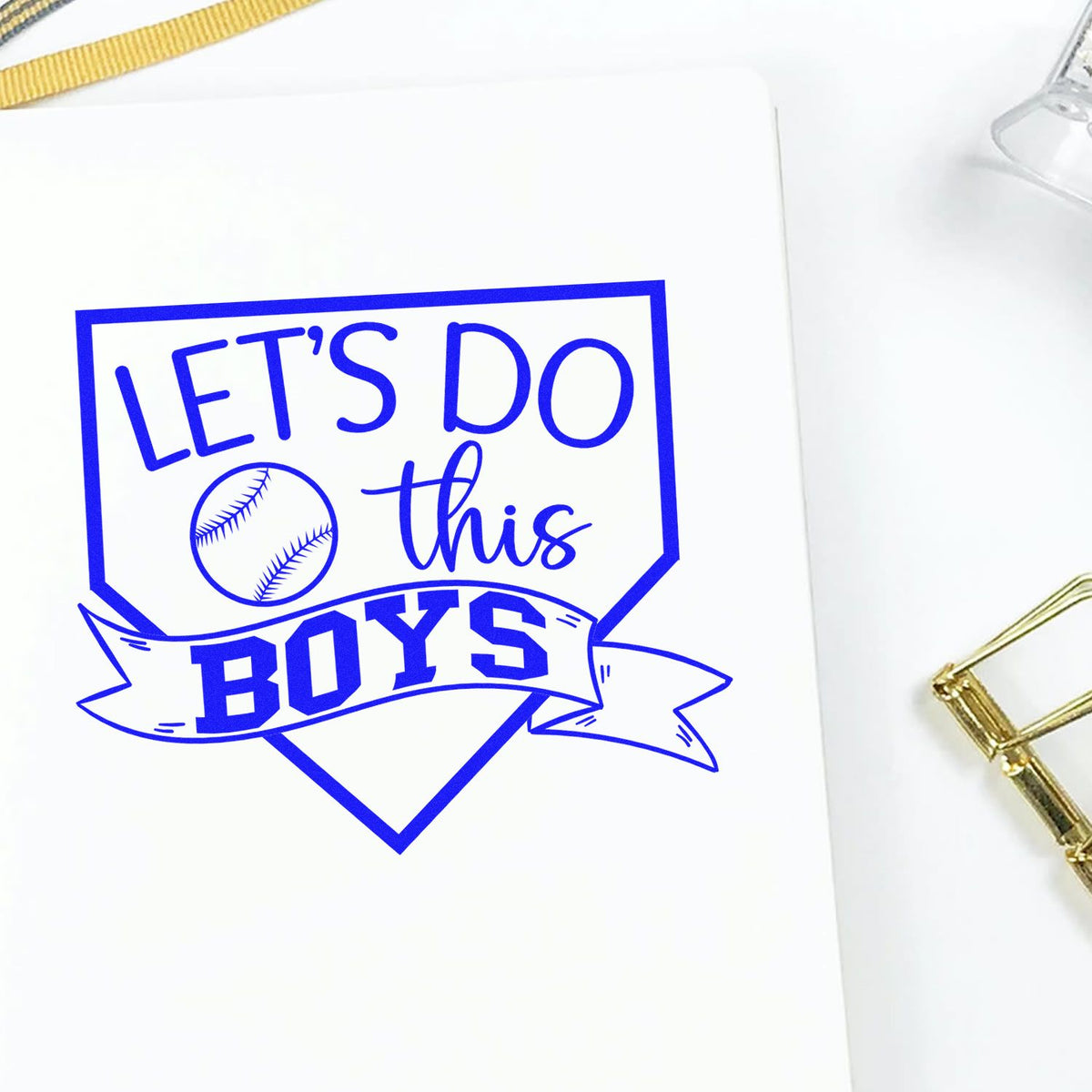 Blue baseball-themed stamp and seal design reading Lets Do This Boys with shield and baseball icon on white paper.
