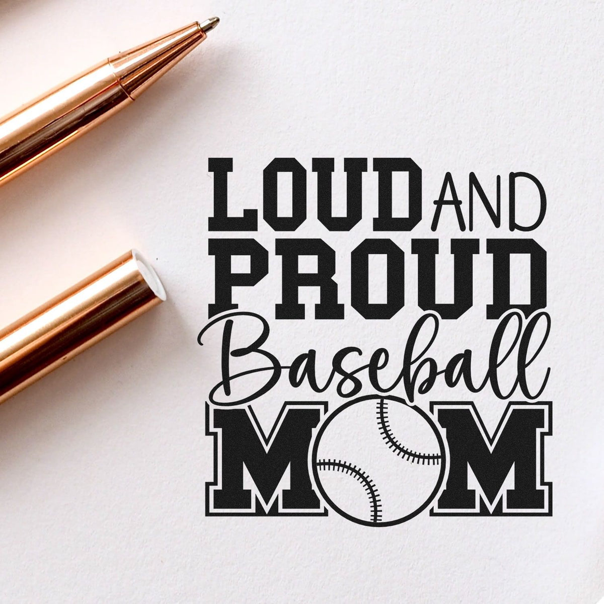 Custom stamp and seal design reading Loud and Proud Baseball Mom in black on white, with rose gold pen accents.