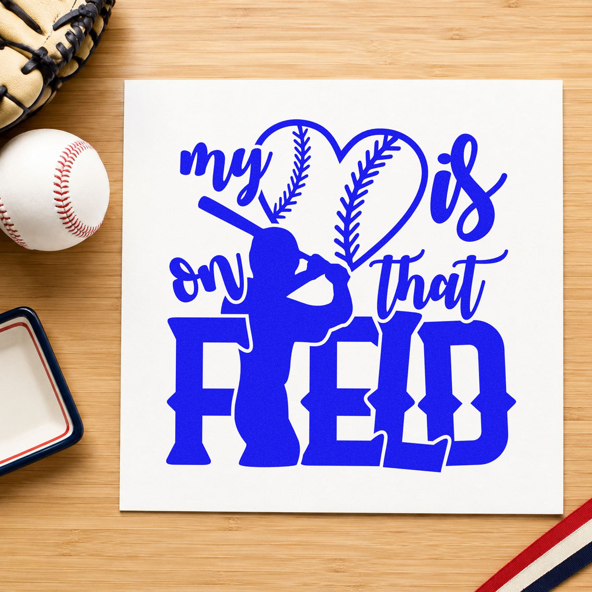 My Heart Is on That Field craft stamp in blue ink on cardstock, an easy option for tote bag printing.