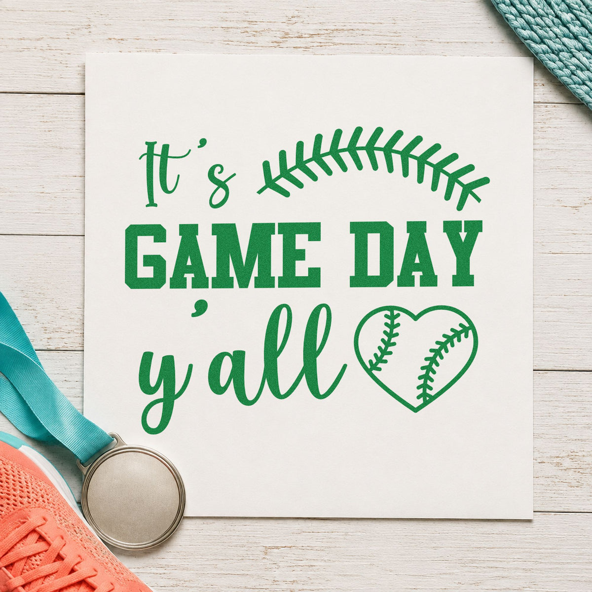 Game Day Y'all craft stamp imprint in green ink on a handmade project, one idea being planner date marks.