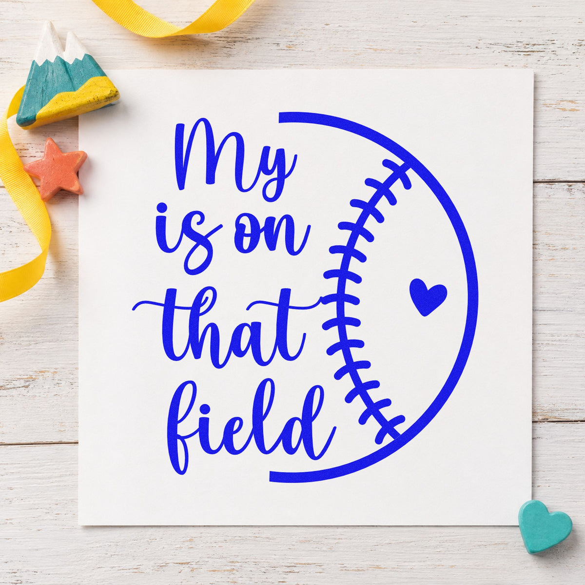 Heart on the Field Half Ball craft stamp imprinted in blue ink on paper, a design suited to tote bag printing.