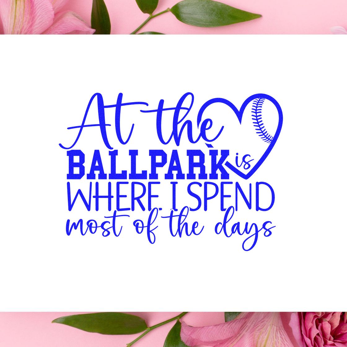 Blue baseball-themed stamp seal reading At the ballpark is where I spend most of the days, with heart lacing on white and pink florals.